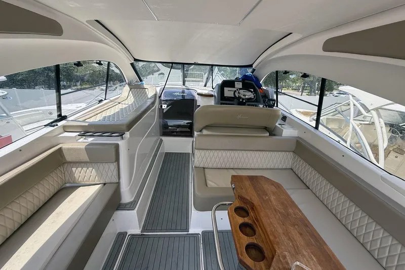  Yacht Photos Pics Luxurious interior of 2024 Hanover 375 yacht with elegant seating and wooden table.