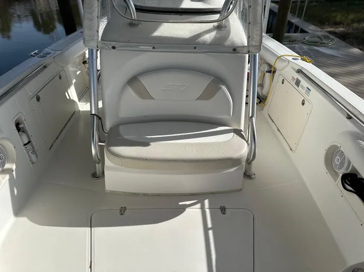  Yacht Photos Pics 2004 Boston Whaler 32 Outrage boat interior with seating and storage compartments.