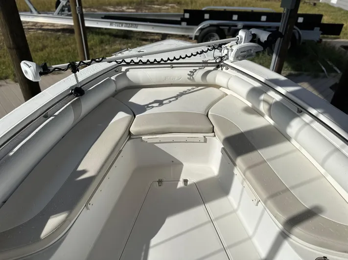  Yacht Photos Pics 2004 Boston Whaler 32 Outrage boat interior with cushioned seating and anchor setup.