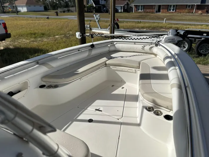  Yacht Photos Pics 2004 Boston Whaler 32 Outrage boat interior with seating and storage compartments.