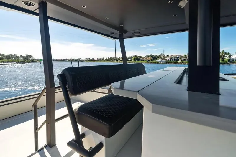  Yacht Photos Pics Luxurious seating area on 2019 DutchCraft 56 Open yacht with scenic water view.
