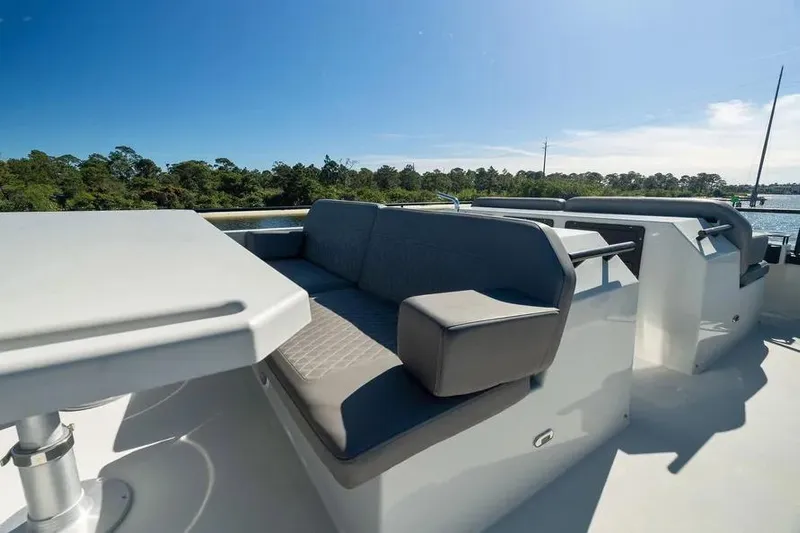  Yacht Photos Pics Luxurious seating area on 2019 DutchCraft 56 Open yacht, with scenic water view.