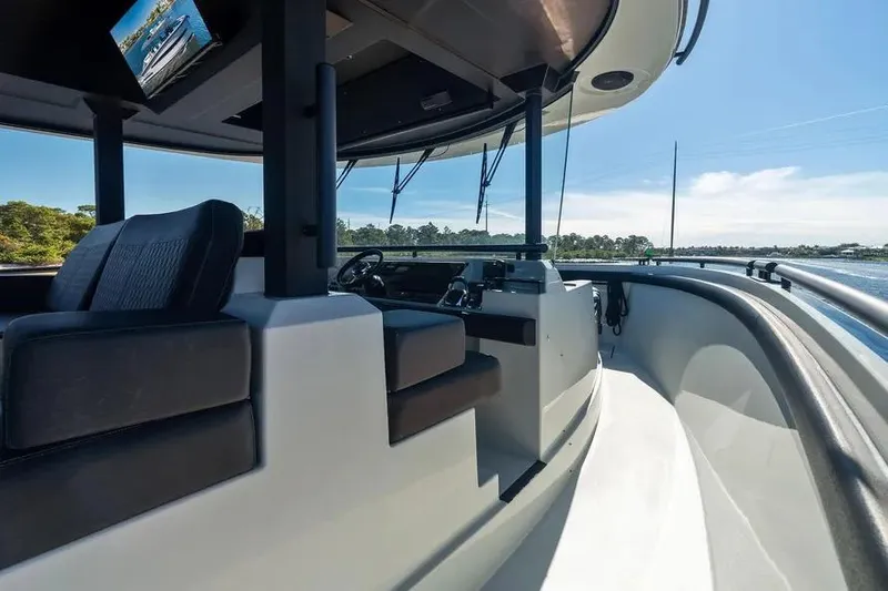  Yacht Photos Pics 2019 DutchCraft 56 Open yacht interior with modern helm and seating, cruising on a sunny day.