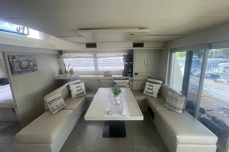  Yacht Photos Pics Luxurious interior of a 2015 Leopard 58 yacht with elegant seating and nautical decor.