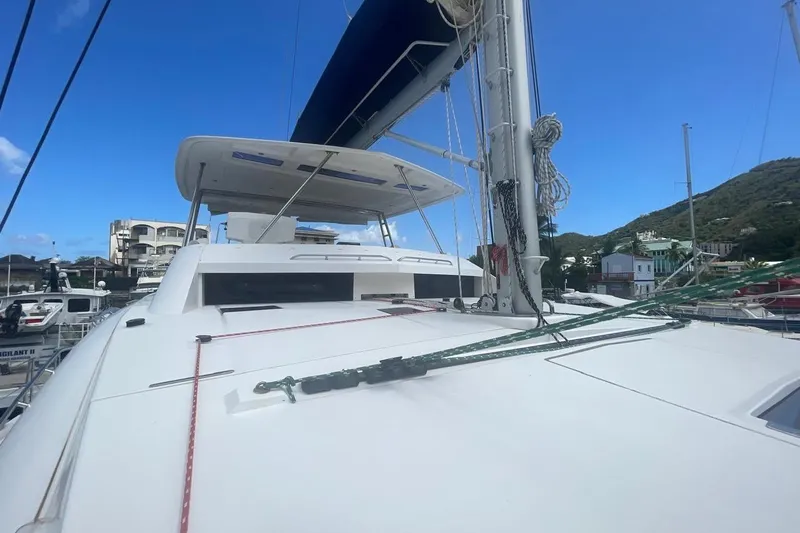  Yacht Photos Pics 2015 Leopard 58 yacht deck with sails, docked in a marina.