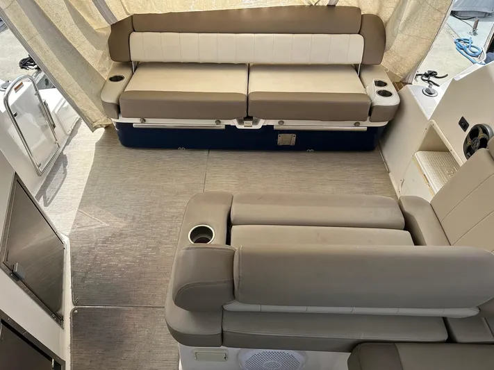 Panacea Yacht Photos Pics Interior of a 2015 Regal 35 Sport Coupe with beige seating and modern design.