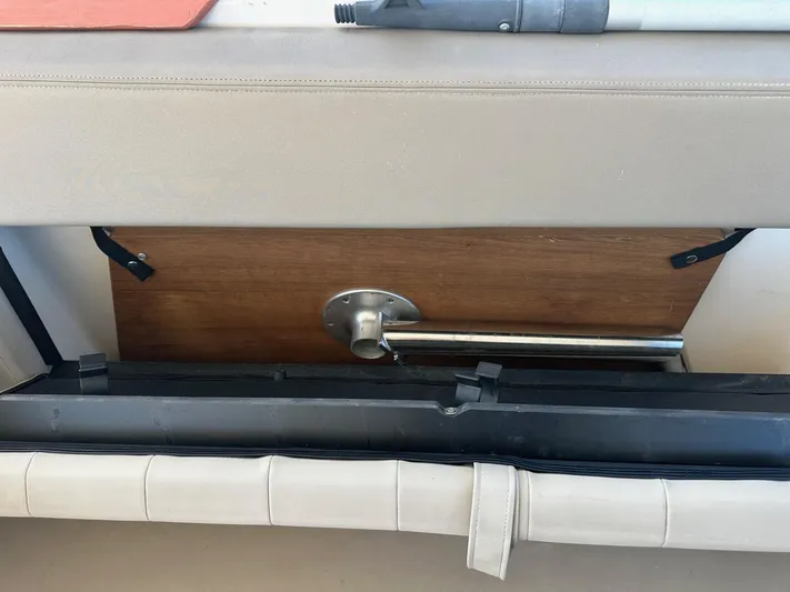 Panacea Yacht Photos Pics Interior detail of a 2015 Regal 35 Sport Coupe boat showing seating and storage area.