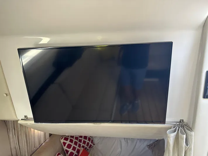 Panacea Yacht Photos Pics Flat-screen TV inside 2015 Regal 35 Sport Coupe yacht cabin.