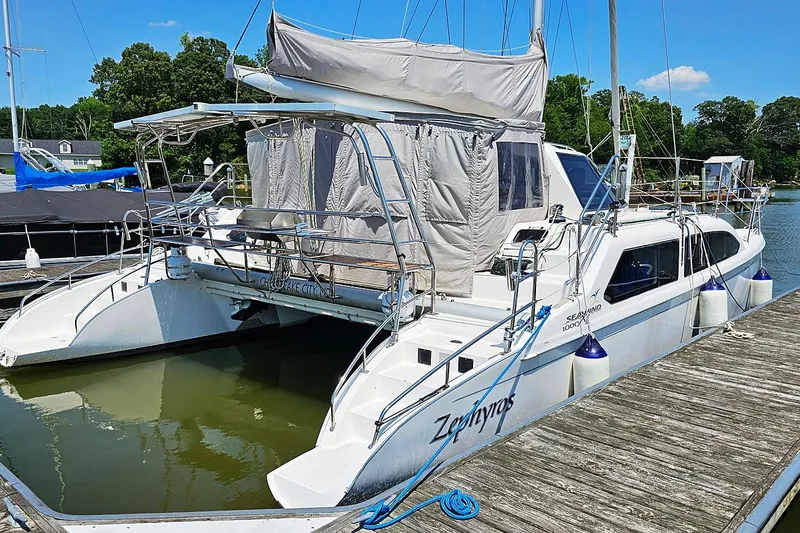 Zephyros Yacht Photos Pics 2009 Seawind 36XL catamaran docked, featuring white hull and covered cockpit.