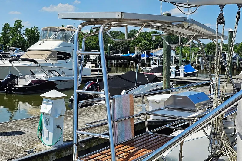 Zephyros Yacht Photos Pics 2009 Seawind 36XL docked at marina with other boats in background.