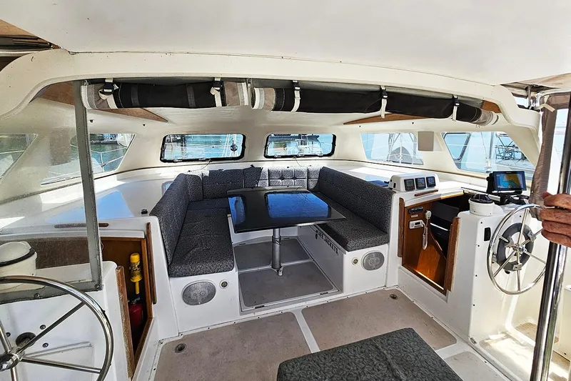 Zephyros Yacht Photos Pics Interior of 2009 Seawind 36XL catamaran with seating, table, and navigation equipment.