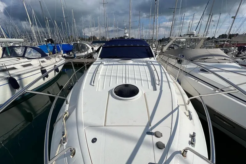  Yacht Photos Pics 2010 Fairline Targa 38 yacht docked among other boats in a marina.