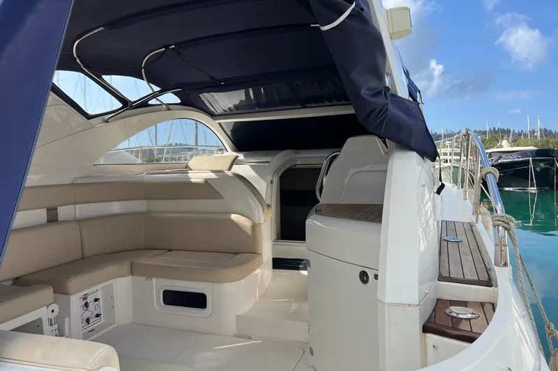  Yacht Photos Pics 2010 Fairline Targa 38 yacht interior with beige seating and blue canopy.