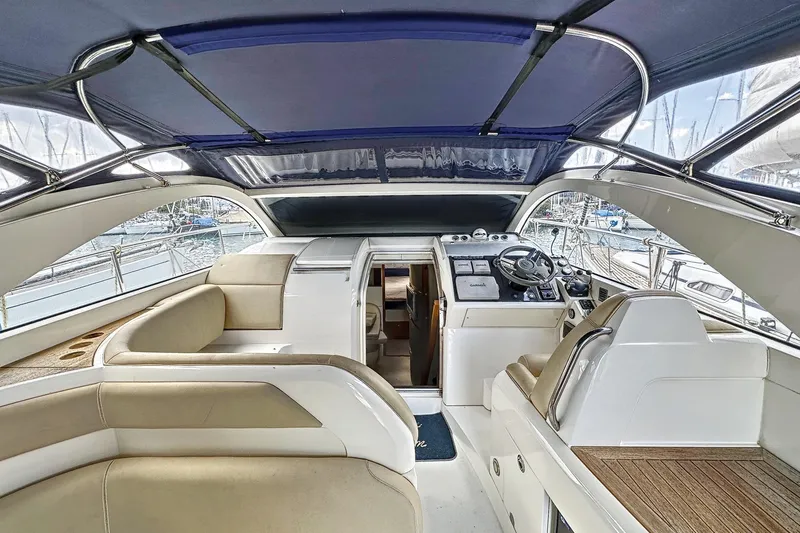  Yacht Photos Pics Interior view of 2010 Fairline Targa 38 yacht with helm and seating area.