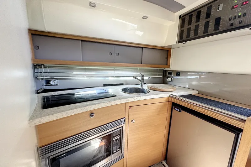  Yacht Photos Pics Modern kitchen in 2010 Fairline Targa 38 yacht with sleek appliances and wood cabinetry.