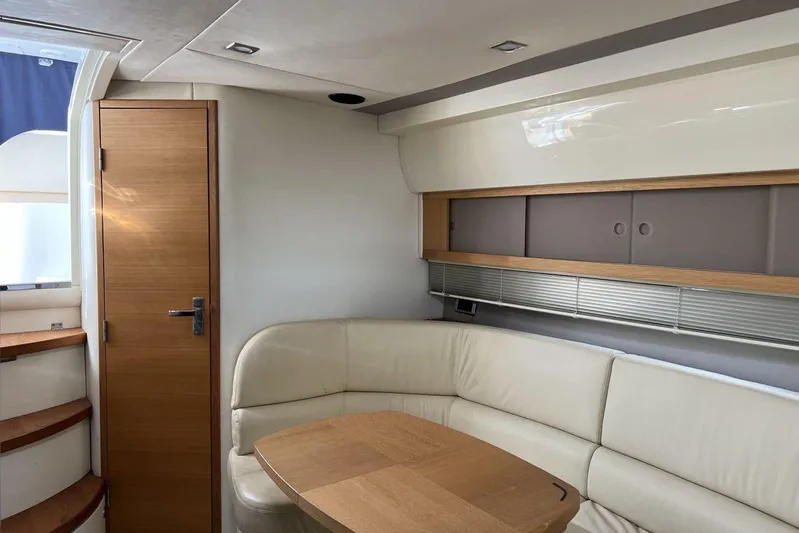  Yacht Photos Pics Interior of 2010 Fairline Targa 38 yacht with cream leather seating and wooden accents.