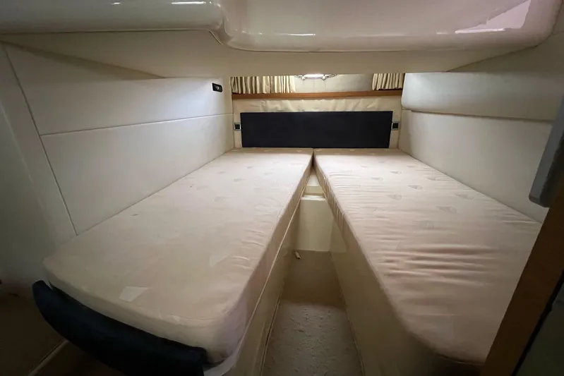  Yacht Photos Pics Interior cabin of 2010 Fairline Targa 38 yacht with twin beds and beige upholstery.