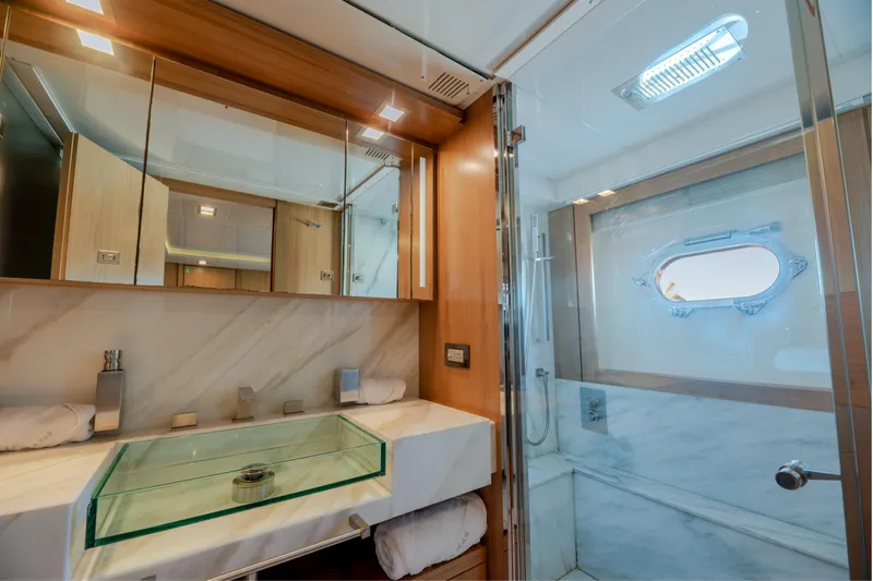  Yacht Photos Pics Luxurious bathroom in 2012 Ferretti Yachts Custom Line 100, featuring modern fixtures and elegant design.