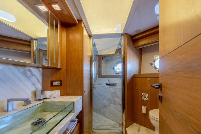 Yacht Photos Pics Luxurious bathroom in 2012 Ferretti Yachts Custom Line 100, featuring elegant wood and marble finishes.