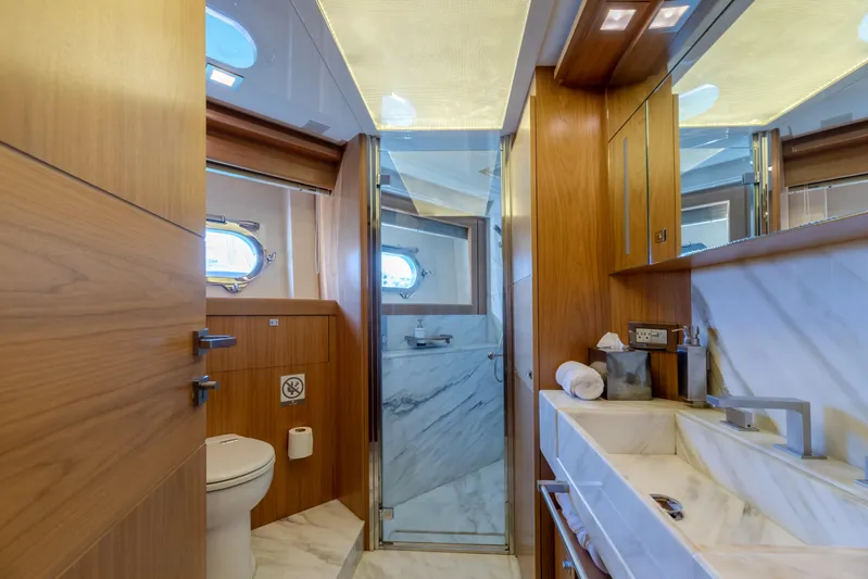  Yacht Photos Pics Luxurious bathroom on 2012 Ferretti Yachts Custom Line 100, featuring wood accents and marble finishes.