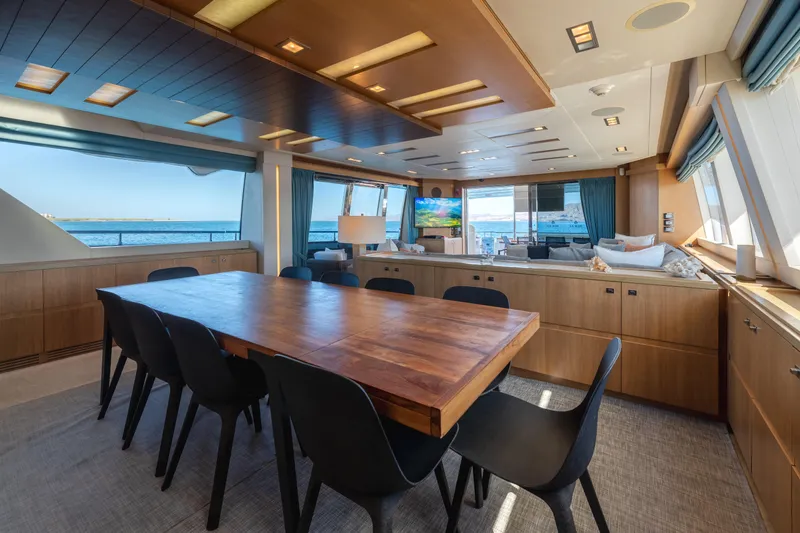  Yacht Photos Pics Luxurious interior of 2012 Ferretti Yachts Custom Line 100 with ocean view and modern dining area.