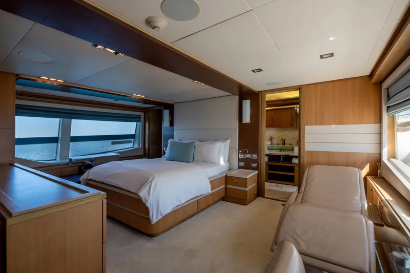  Yacht Photos Pics Luxurious bedroom interior on 2012 Ferretti Yachts Custom Line 100, featuring ocean view windows.