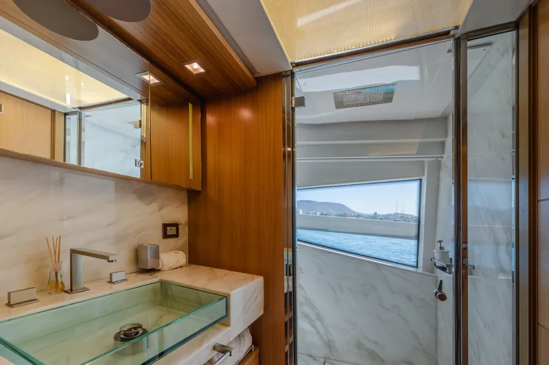  Yacht Photos Pics Luxurious bathroom interior on 2012 Ferretti Yachts Custom Line 100, featuring glass sink and ocean view.