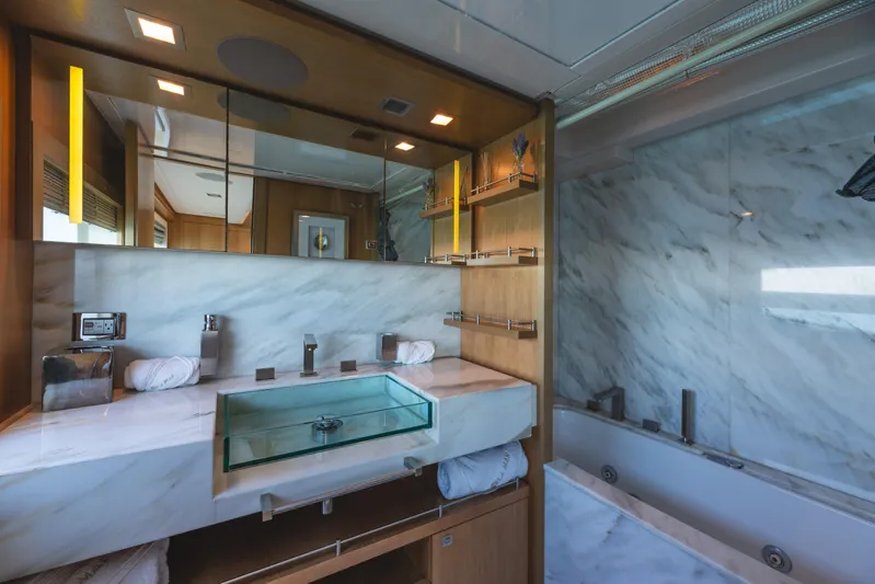  Yacht Photos Pics Luxurious bathroom in 2012 Ferretti Yachts Custom Line 100, featuring marble and modern fixtures.