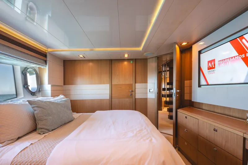  Yacht Photos Pics Luxurious bedroom interior of 2012 Ferretti Yachts Custom Line 100, featuring modern design and elegant furnishings.