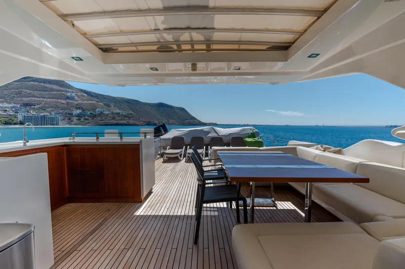  Yacht Photos Pics Luxurious 2012 Ferretti Yachts Custom Line 100 deck with ocean view and elegant seating.