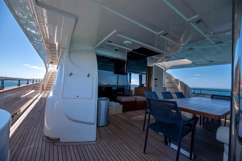  Yacht Photos Pics Luxurious 2012 Ferretti Yachts Custom Line 100 deck with seating and ocean view.