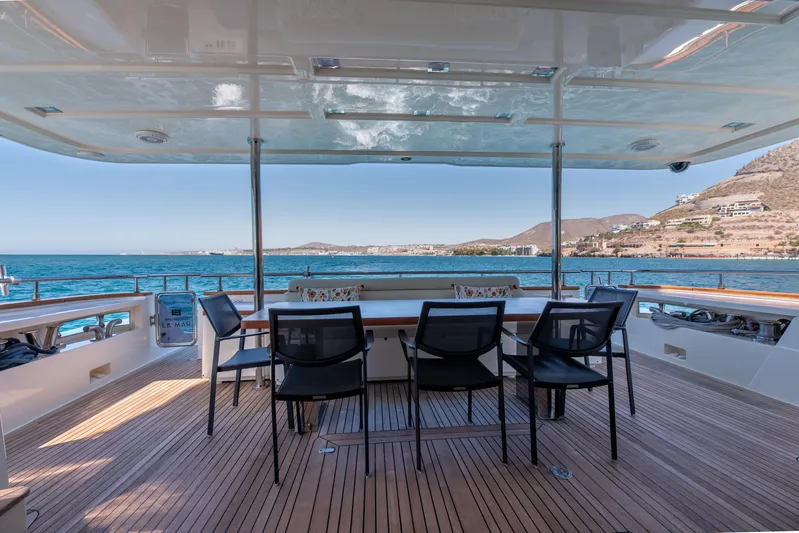  Yacht Photos Pics Luxurious 2012 Ferretti Yachts Custom Line 100 deck with ocean view and seating area.