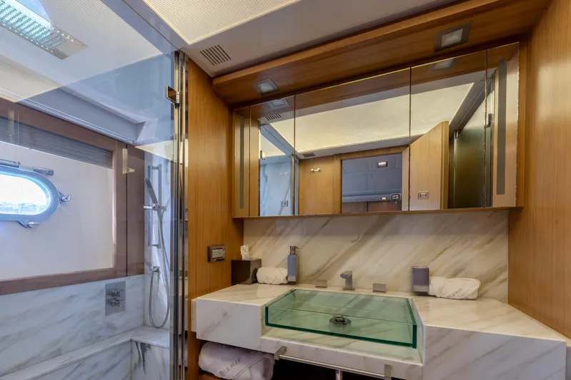  Yacht Photos Pics Luxurious bathroom on 2012 Ferretti Yachts Custom Line 100 with modern fixtures and elegant design.