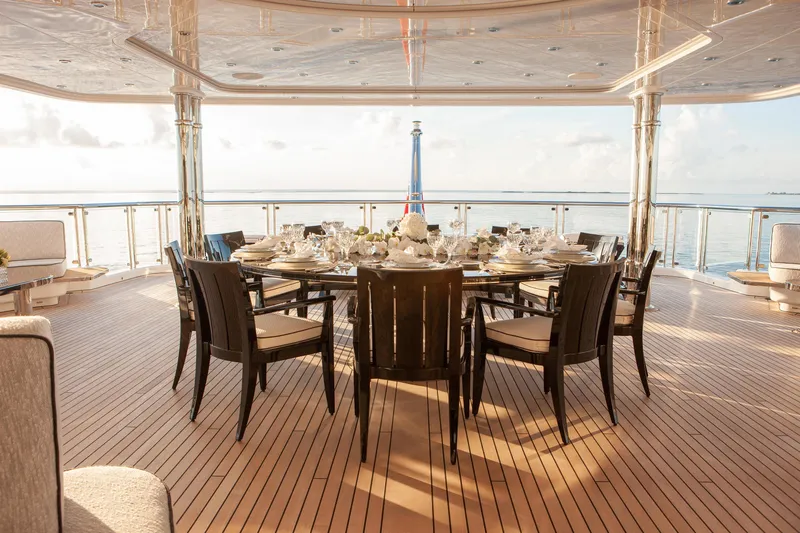 Boardwalk Yacht Photos Pics Luxurious dining area on 2021 Feadship Custom yacht with ocean view.