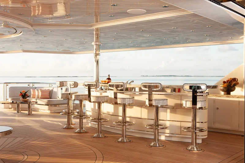 Boardwalk Yacht Photos Pics Luxurious Feadship Costum 2021 yacht deck with bar and ocean view.