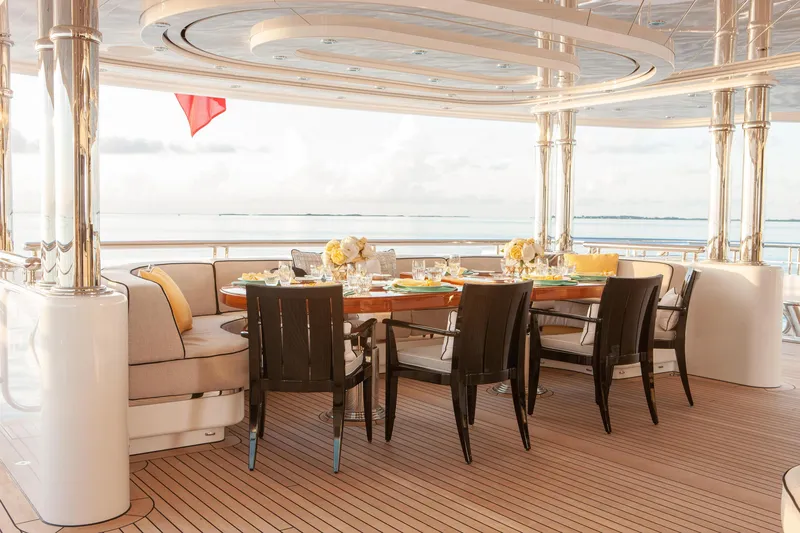 Boardwalk Yacht Photos Pics Luxurious 2021 Feadship Custom yacht deck with elegant dining setup and ocean view.