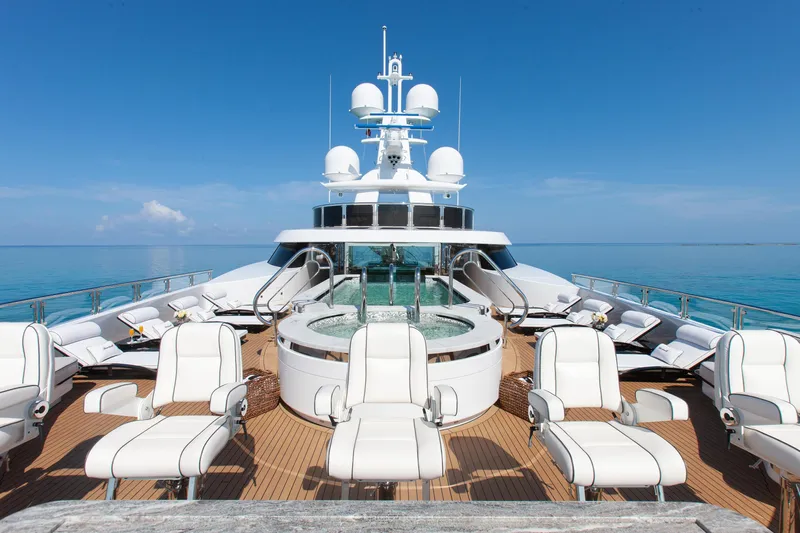 Boardwalk Yacht Photos Pics Luxurious 2021 Feadship Custom yacht deck with jacuzzi and white lounge chairs.
