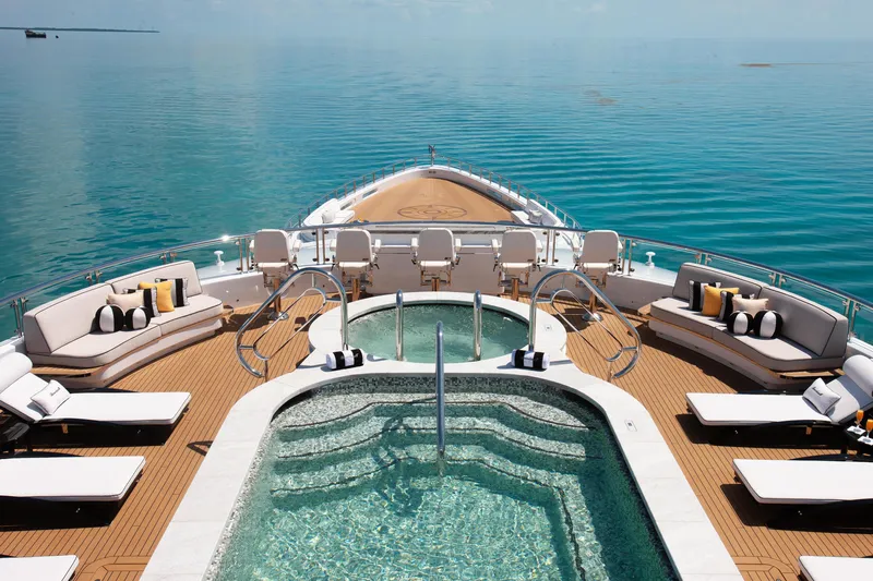 Boardwalk Yacht Photos Pics Luxurious 2021 Feadship Custom yacht deck with pool, sun loungers, and ocean view.