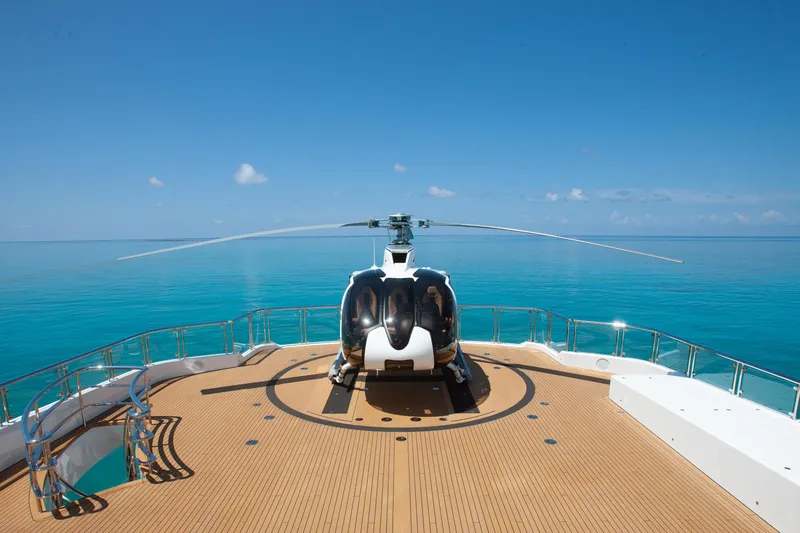 Boardwalk Yacht Photos Pics Helicopter on Feadship Custom yacht deck, 2021, with ocean view.