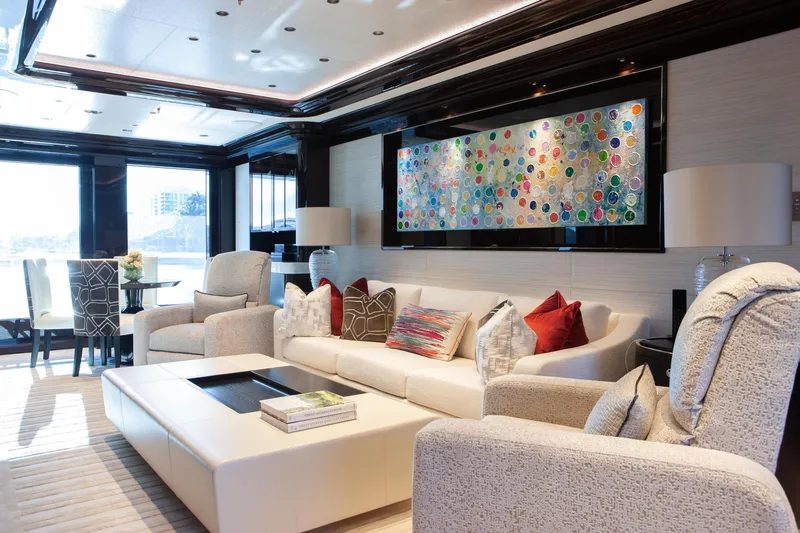 Boardwalk Yacht Photos Pics Luxurious Feadship 2021 yacht interior with elegant seating, colorful artwork, and modern decor.
