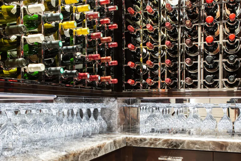 Boardwalk Yacht Photos Pics Luxurious wine rack and glasses on Feadship Costum yacht, 2021 model.