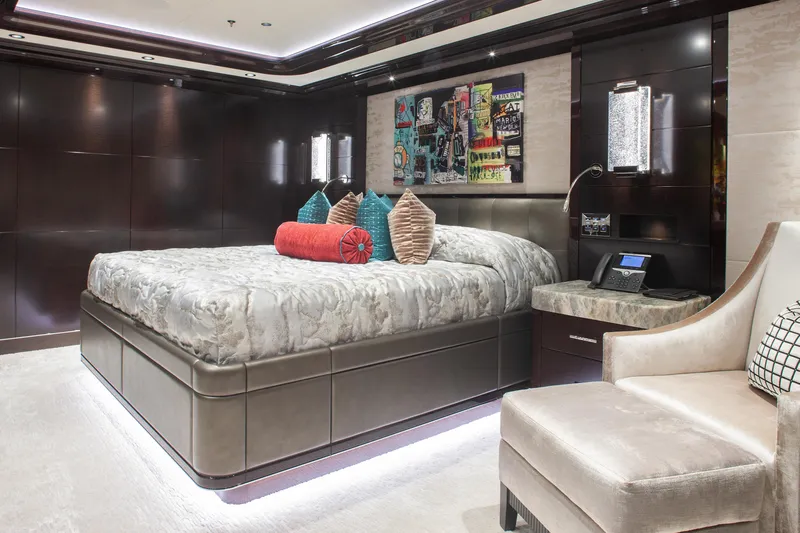 Boardwalk Yacht Photos Pics Luxurious Feadship Costum 2021 yacht bedroom with modern decor and plush bedding.