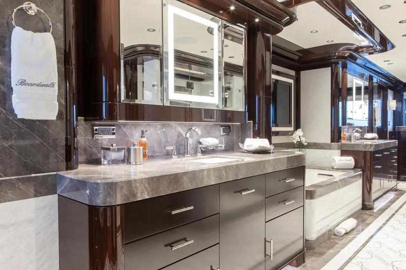 Boardwalk Yacht Photos Pics Luxurious yacht bathroom with marble countertops, elegant fixtures, and modern design, Feadship Custom 2021.