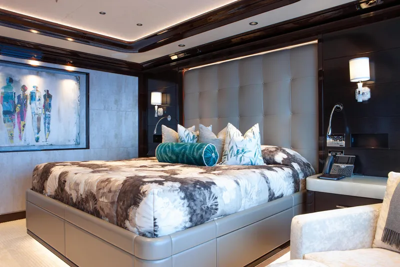 Boardwalk Yacht Photos Pics Luxurious bedroom interior on 2021 Feadship Custom yacht, featuring elegant decor and modern amenities.