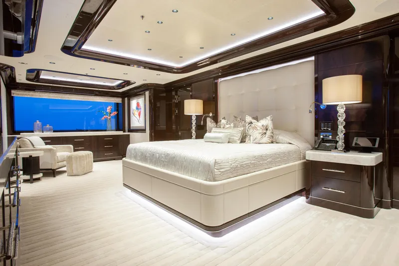 Boardwalk Yacht Photos Pics Luxurious Feadship Custom 2021 yacht bedroom with elegant decor and modern furnishings.