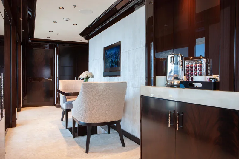 Boardwalk Yacht Photos Pics Luxurious Feadship Custom 2021 yacht interior with elegant dining area and modern coffee station.
