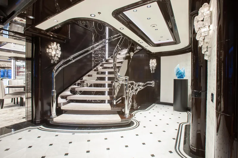 Boardwalk Yacht Photos Pics Luxurious interior of 2021 Feadship Custom yacht with elegant staircase and modern decor.