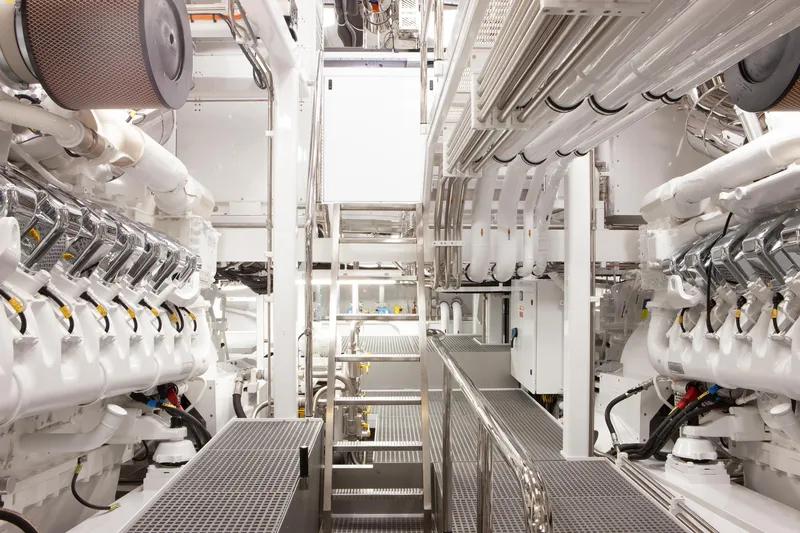 Boardwalk Yacht Photos Pics Engine room of 2021 Feadship Custom yacht, showcasing advanced machinery and piping systems.