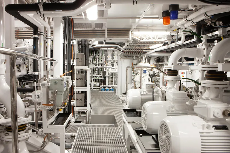 Boardwalk Yacht Photos Pics Engine room of 2021 Feadship Custom yacht, featuring advanced machinery and piping systems.