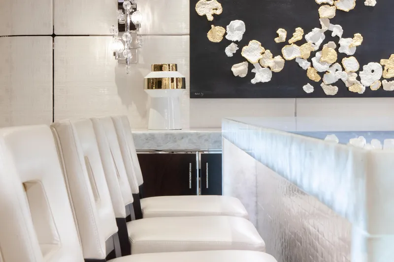 Boardwalk Yacht Photos Pics Luxurious Feadship Costum 2021 yacht interior with elegant seating and modern art decor.